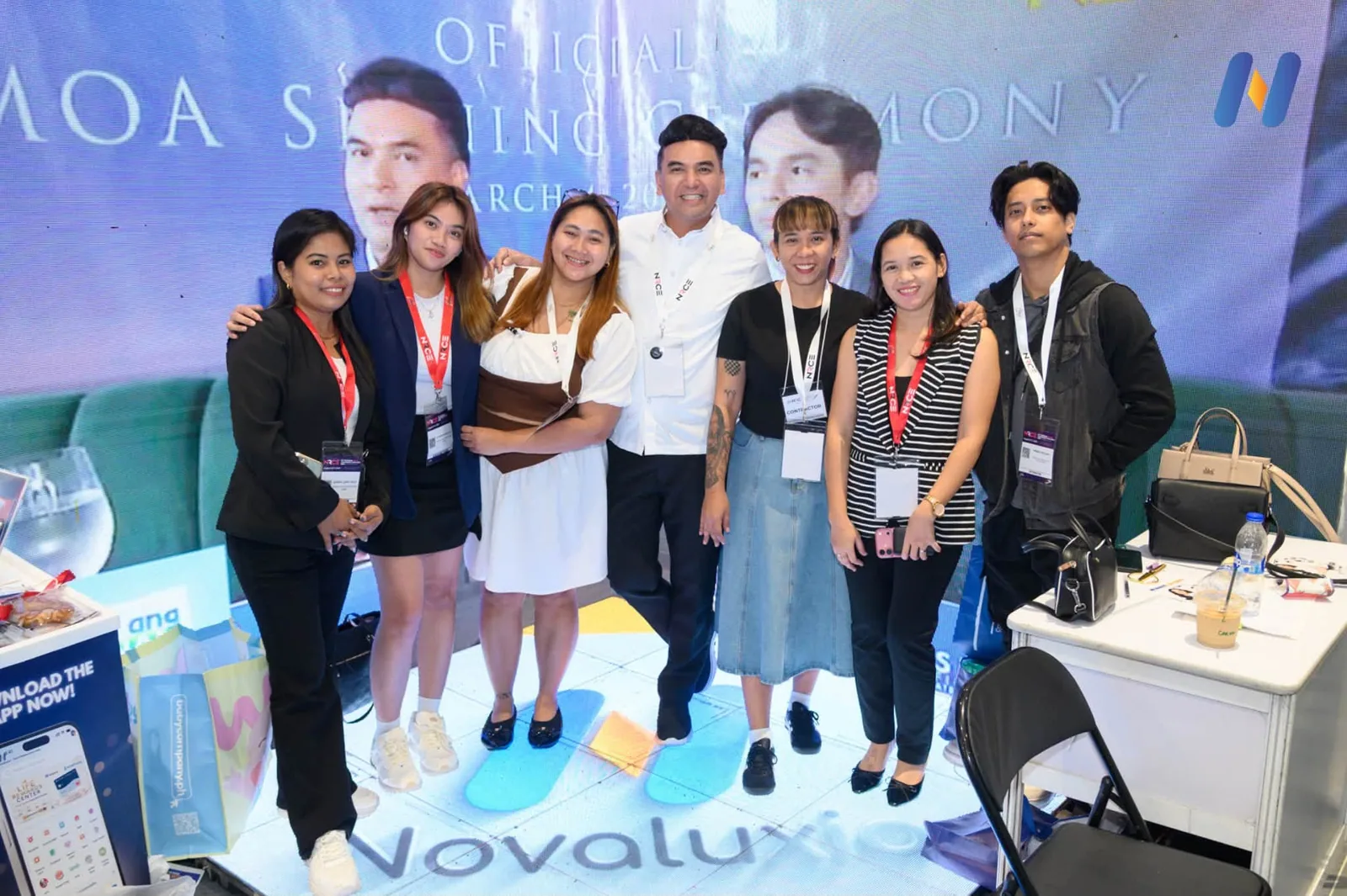 Novaluxia PH team on stage at the official launching ceremony, standing in front of the event backdrop